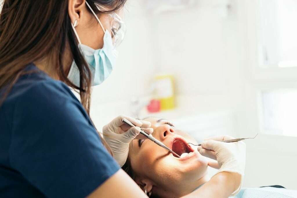 dentists-with-a-patient-during-a-regular-dental-check-up-1024x684 dentists-with-a-patient-during-a-regular-dental-check-up